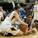 Manchester senior McKenna Erkfritz attempts to strip the ball away from a Saginaw Nouvel player on Saturday, March 16. Daniel Brenner I AnnArbor.com
